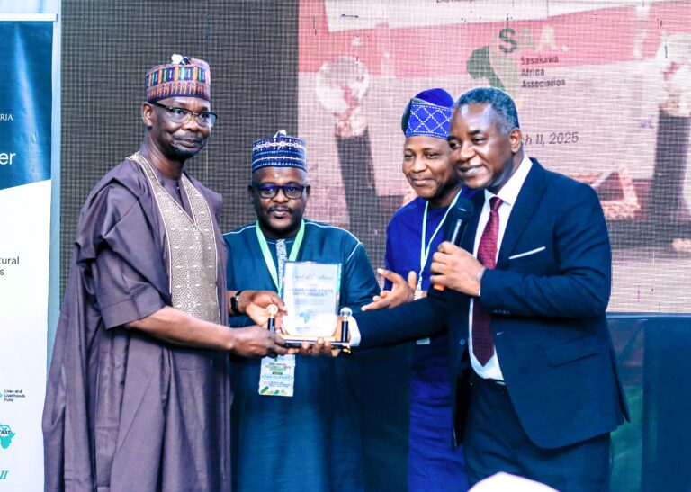 Governor Sule receiving the award from the Country Director, SAA Nigeria, Dr Godwin Atser.